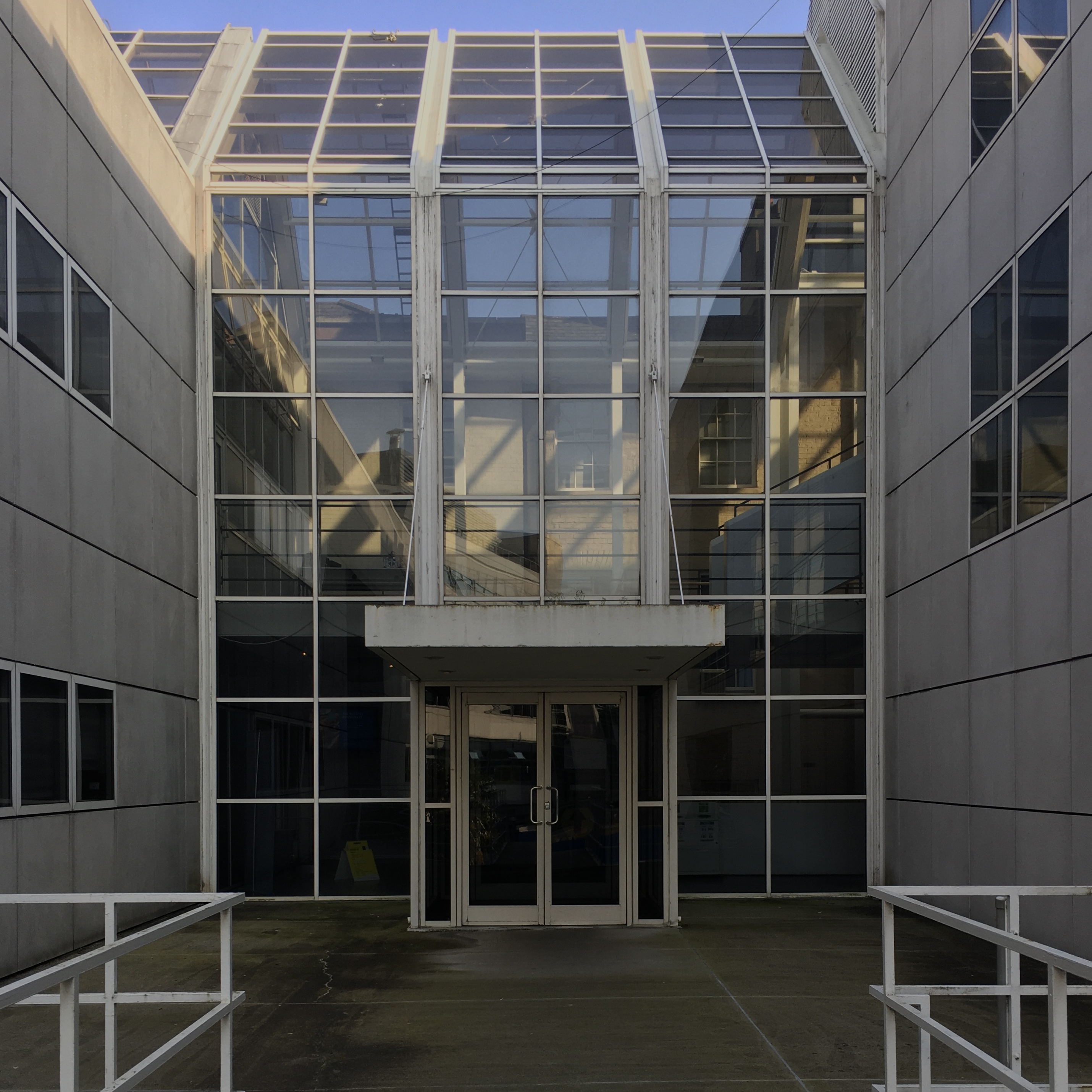 Hamilton building: The glass atrium forms an indoor street connecting to the townhouses on the outside of campus.